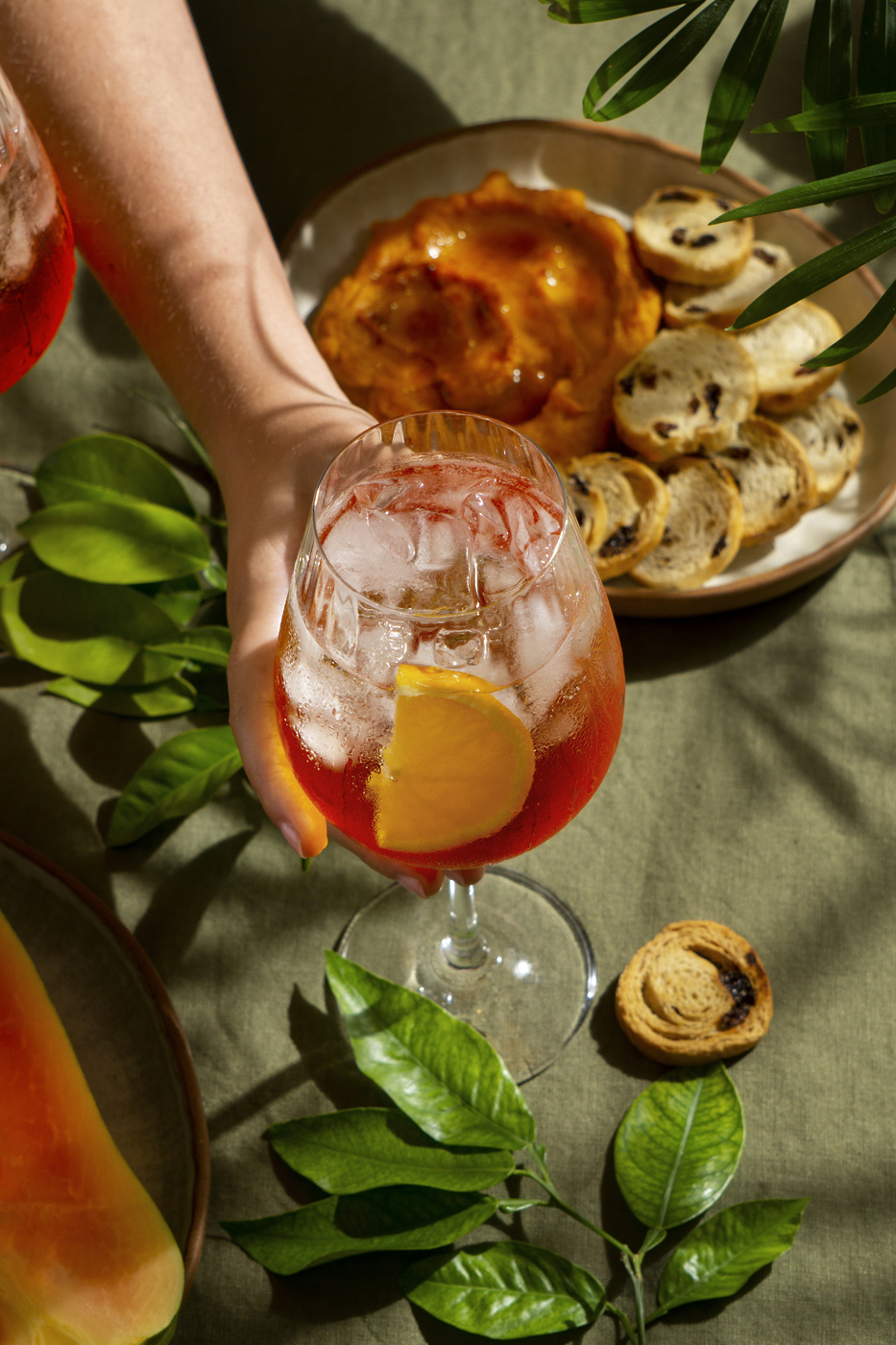 hand holding italian cocktail still life